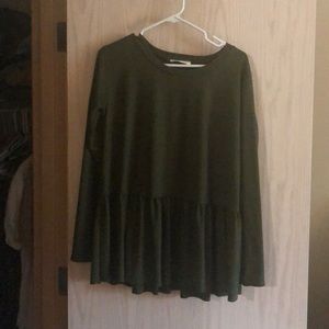 Green peplum long sleeved shirt.